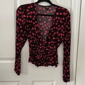 Black shirt with red flower detailing